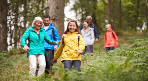 Family walking through the woods